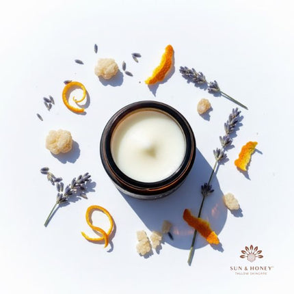sun and honey tallow balm with dried frankincense lavender sprigs and orange peel for blog post showing the benefits of these essential oils in tallow skincare