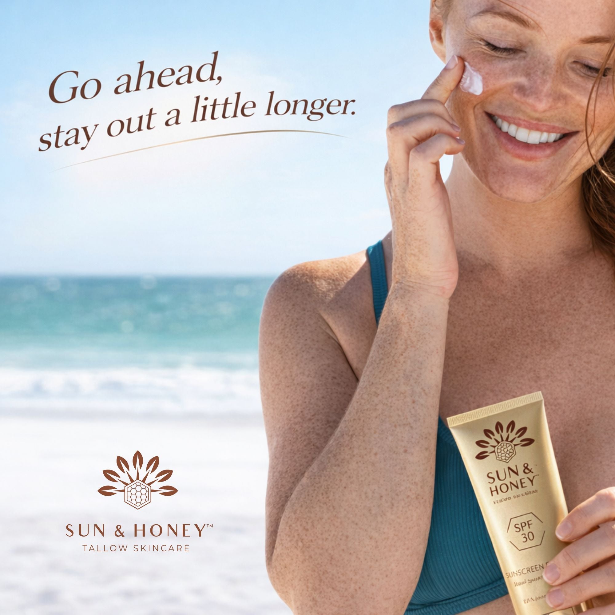 Freckled Woman at beach putting Sun and Honey Tallow Sunscreen on her face